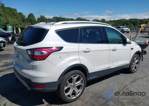 2017 Ford Escape Titanium z USA, uszkodzony, nr VIN 1FMCU9J93HUD64447